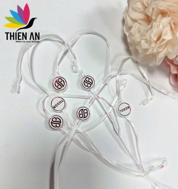 Dây treo logo - Nhãn Mác và Bao Bì Thiên Ân - Công Ty TNHH Nhãn Mác Và Bao Bì Thiên Ân