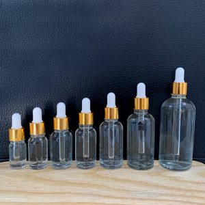 Chai đựng serum trong khoen vàng núm trắng