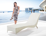 Outdoor white wicker chaise lounges